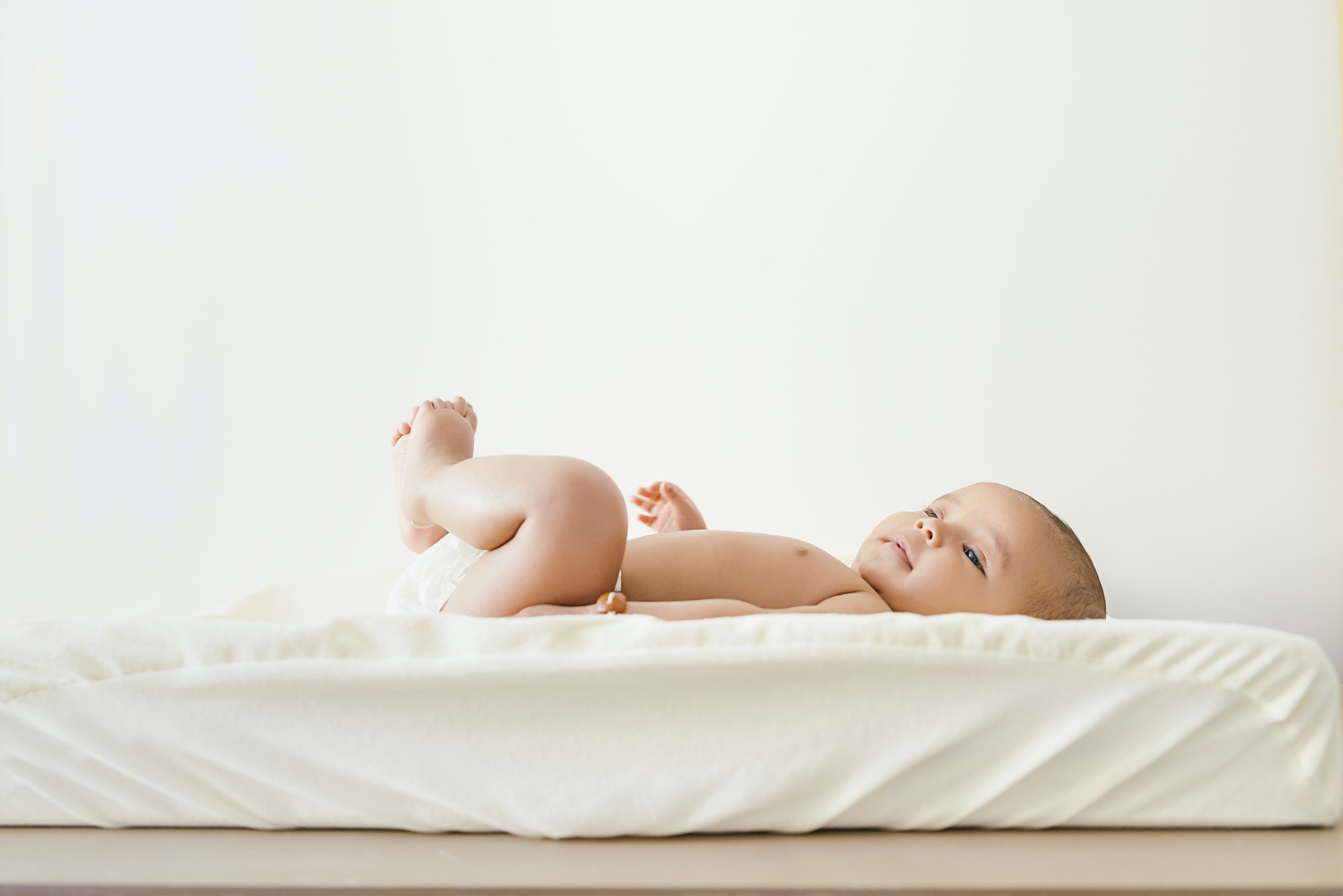 Cute Baby Girl Lying in the Baby Changer.